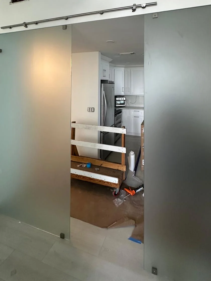 Frosted glass sliding doors installed during a remodel