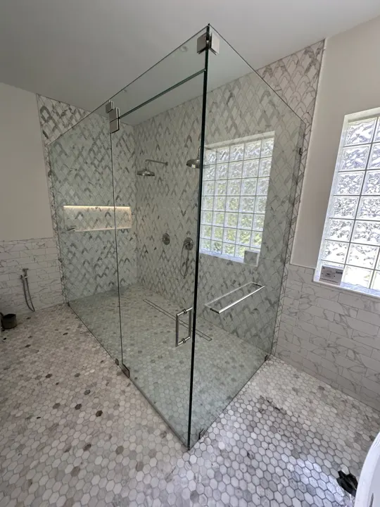 Corner shower with marble mosaic floor