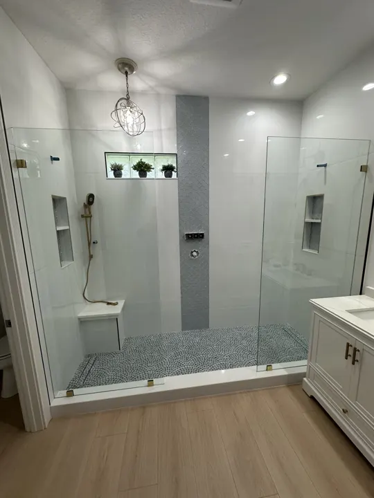 Inline shower door with fixed panels and wood floor