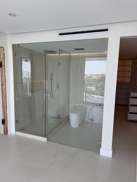Inline shower glass in a bright bathroom
